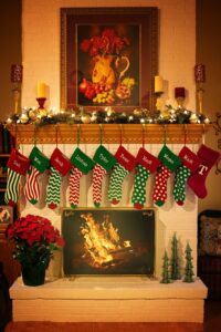 Personalized Christmas stockings by the fireplace.